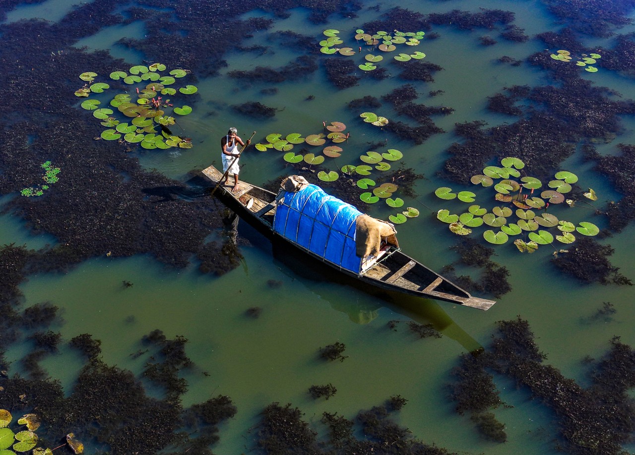 Fisher man with his boat - Nature Photography Gallery